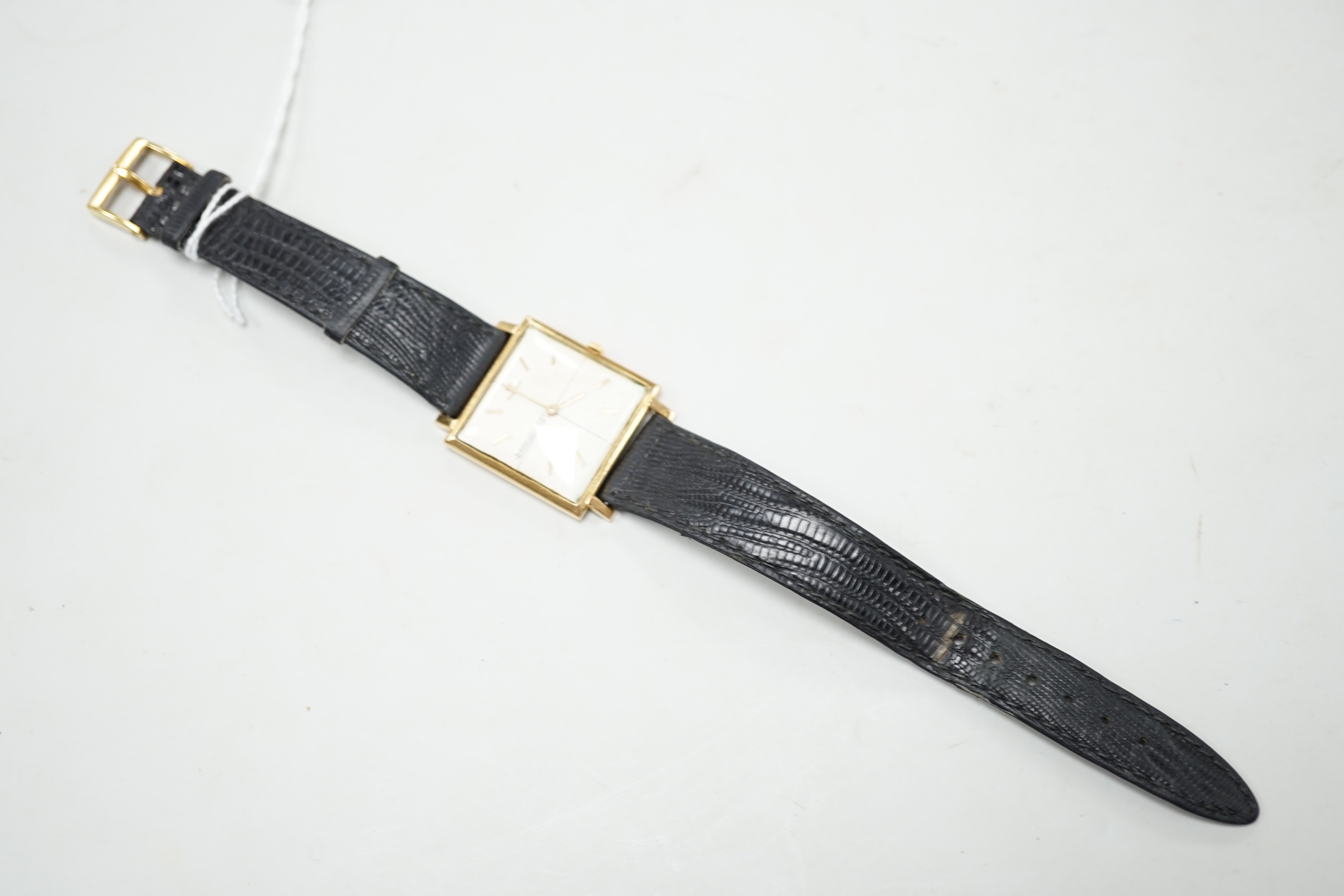 A gentleman's yellow metal (Swiss 750 mark) Jaeger LeCoultre manual wind dress wrist watch, on associated leather strap, no box or papers.